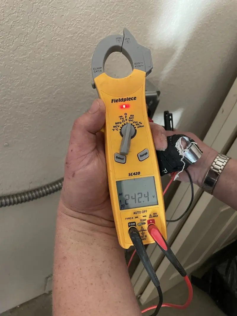 Voltage testing with clamp meter during Electrical Installation Services in Burrillville
